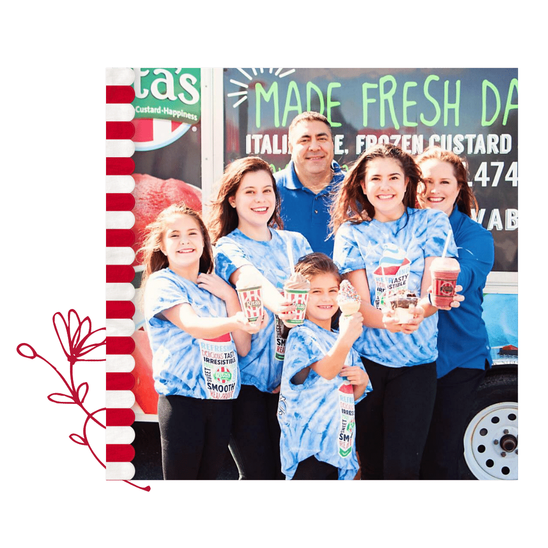 A family of five dressed in blue shirts, the kids in tye-dye, hold branded cups of Rita's frozen treats in front of a Rita's window. A red and white striped awning illustration decorates the left side of the photo where a cartoon flower is drawn in red