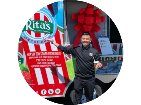 Man in front of a Rita's Ice Food Truck